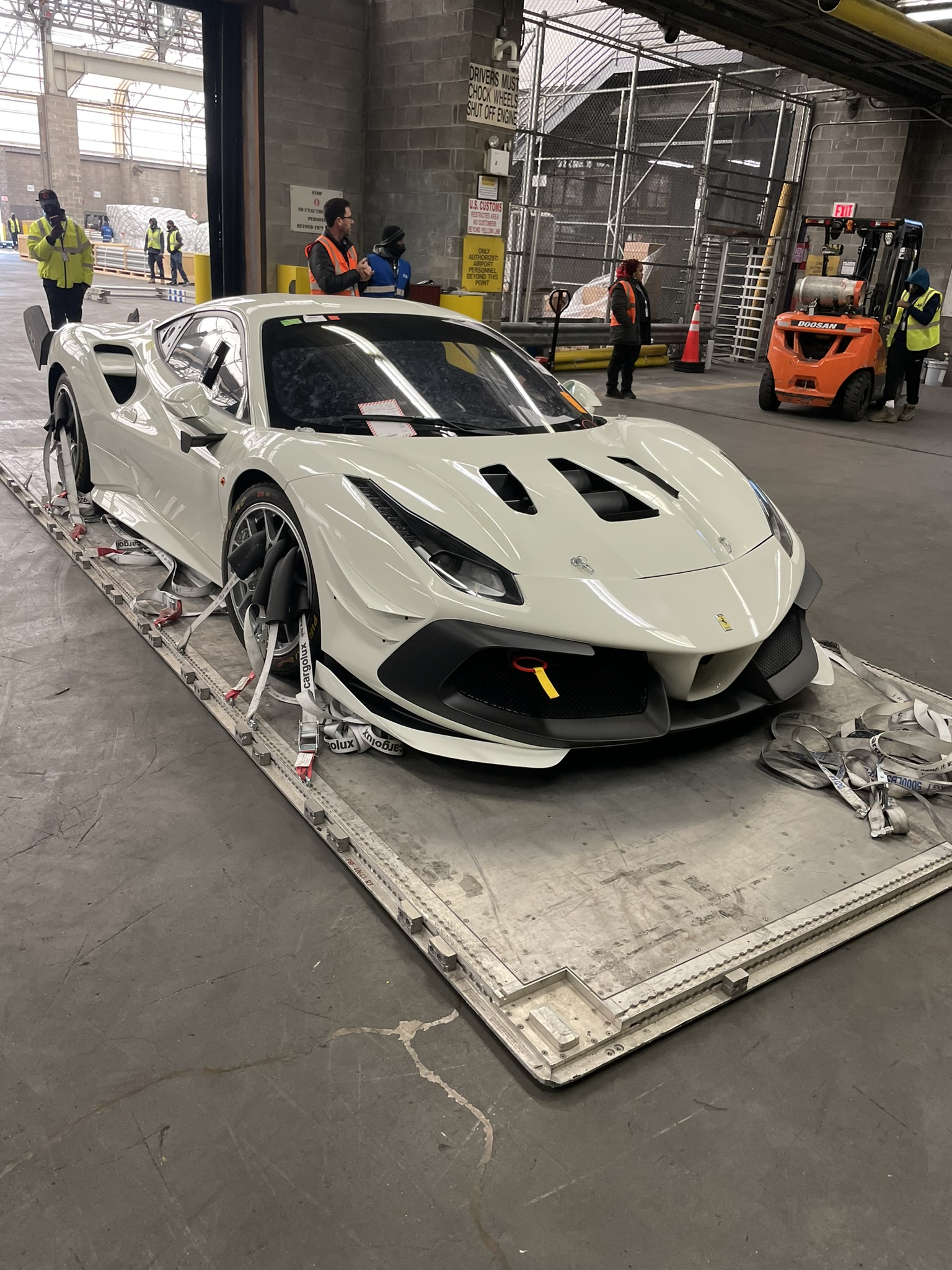 A striking image of a Ferrari 488 GT3, showcasing its sleek design and racing features in a dynamic setting.